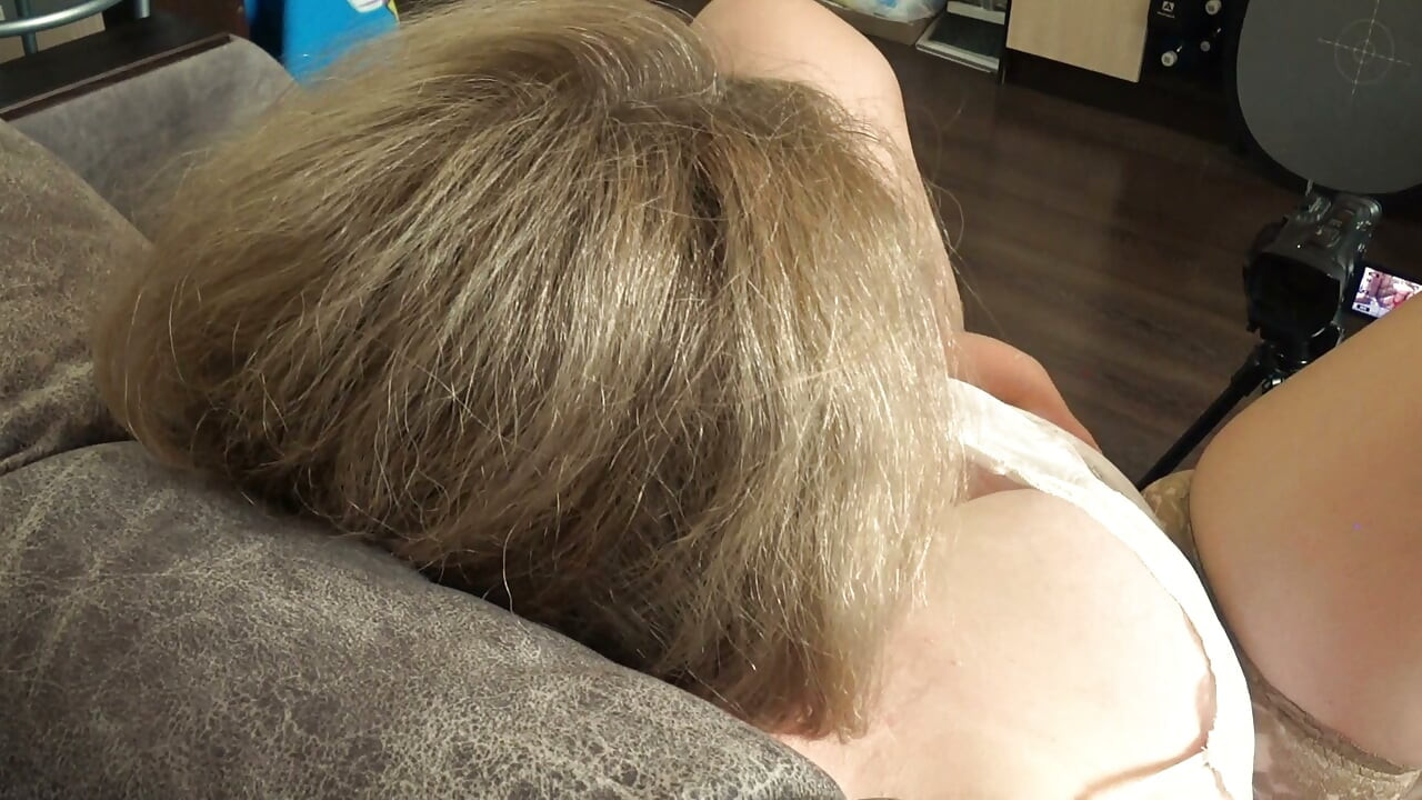 Big Tits From Above. a Camera Watches From the Side as a Plump MILF Masturbates and Records a Video.