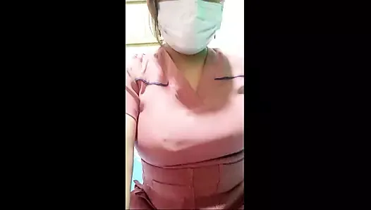 The beautiful nurse flirts with her boss while they are on video call, she shows him her cute youthful tits