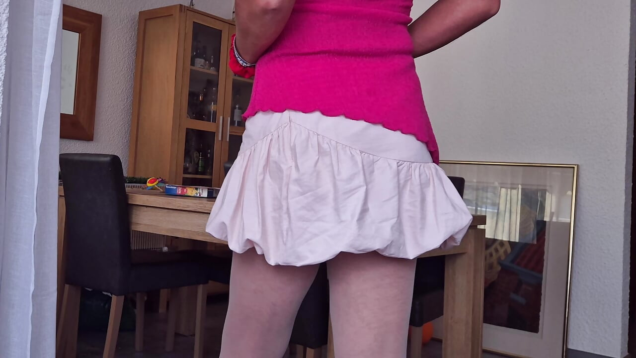 Cute femboy Xunami shows ass and white panties in her lovely pink skirt