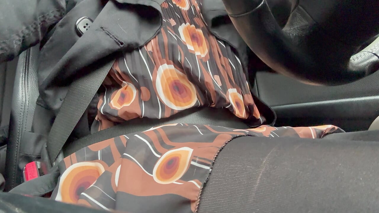 Elegant stepmom drives to the office wearing tights and a beautiful dress