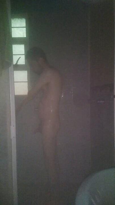 Man Showering with Flashlight On