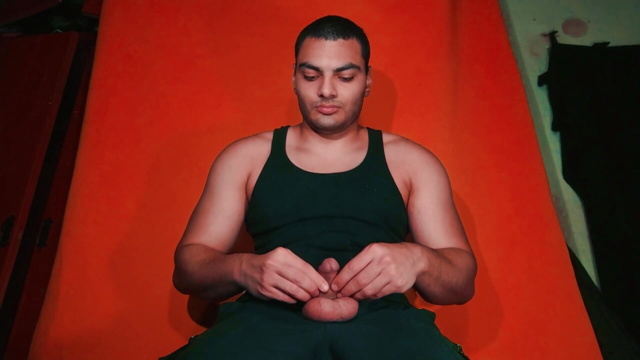 Masturbation of large penis on carrot colored background - GuitarJob - Guitar Masturbation