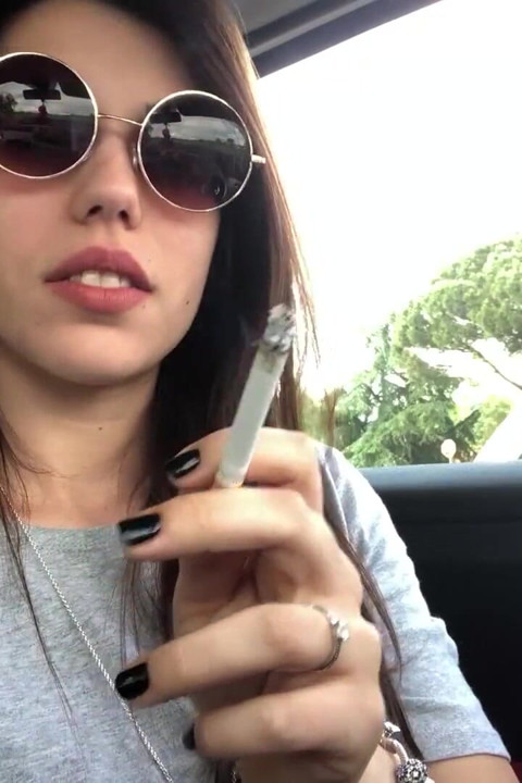 Petra smoking in car
