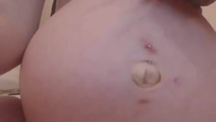 A soon to be Milf  shows off her bump