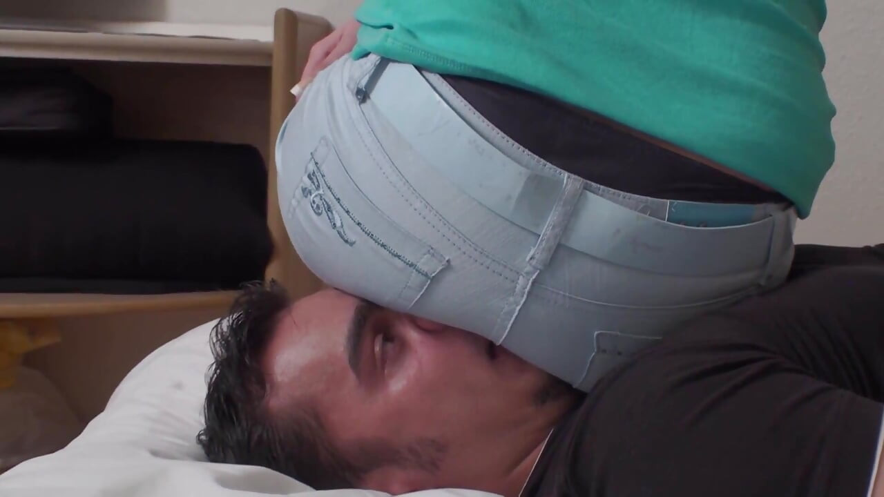 Watching TV sitting on slave's face