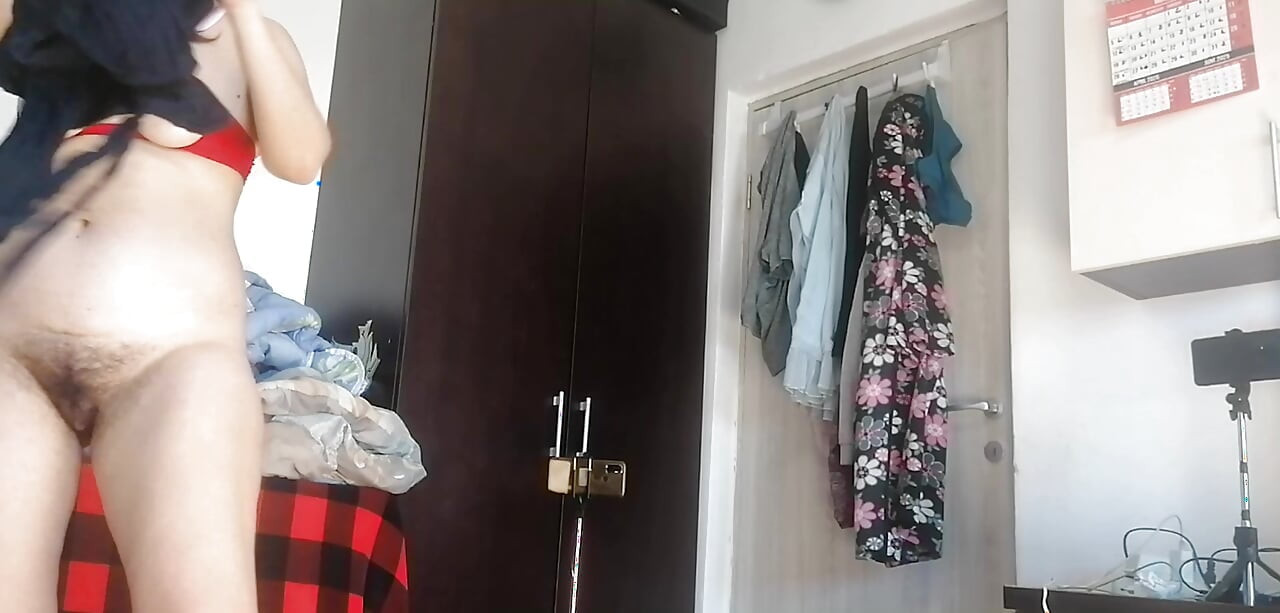 Sexy Latina Having Fun Trying on Clothes and Cutting Them