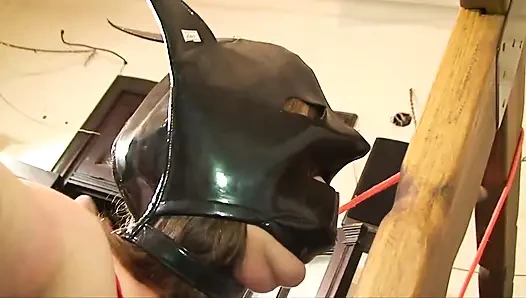 Lezdom woman punishing her masked slave