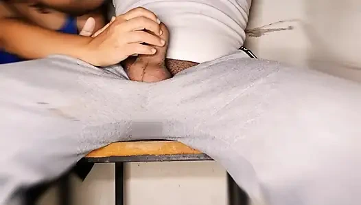 The easy girl in my class gives me a handjob at the back of the classroom while the other students are studying.