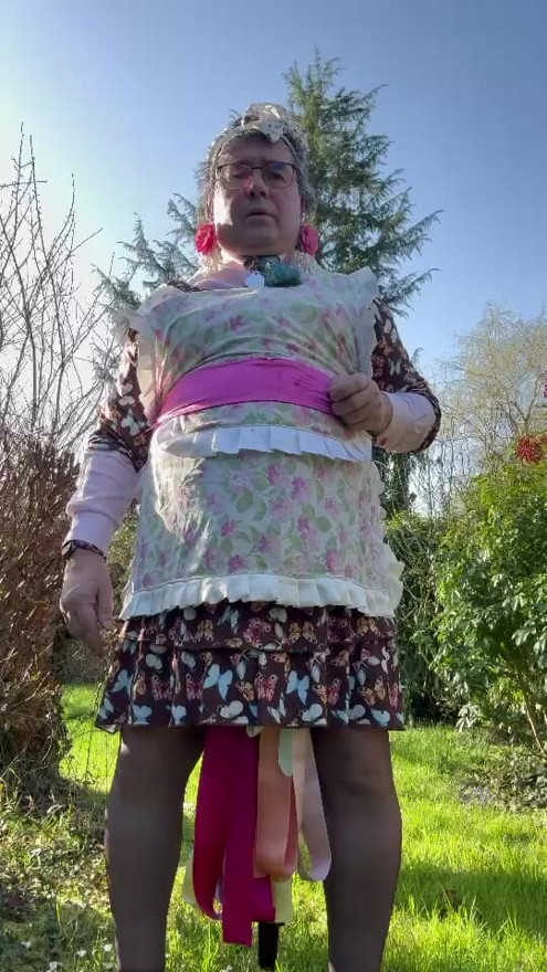 In a gardener outfit and peeing herself