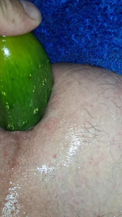 Enjoying cucumber in the ass