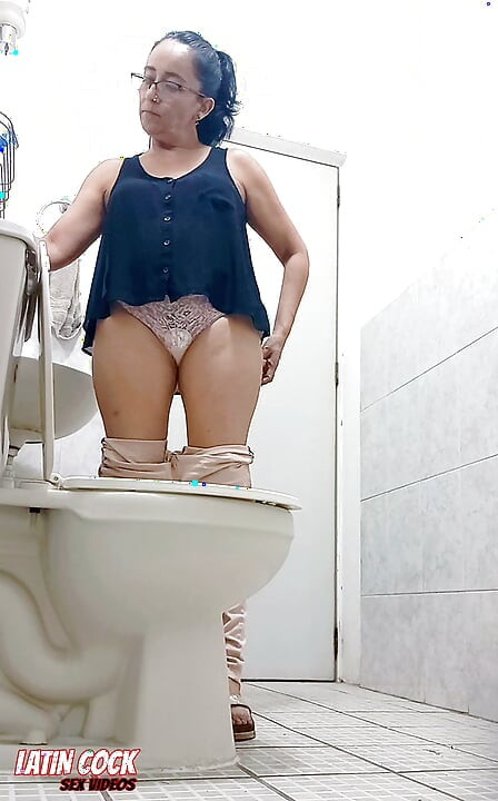 A BEAUTIFUL MATURE WOMAN WITH A GORGEOUS HAIRY PUSSY IS CAUGHT ON AMATEUR VIDEO IN THE BATHROOM