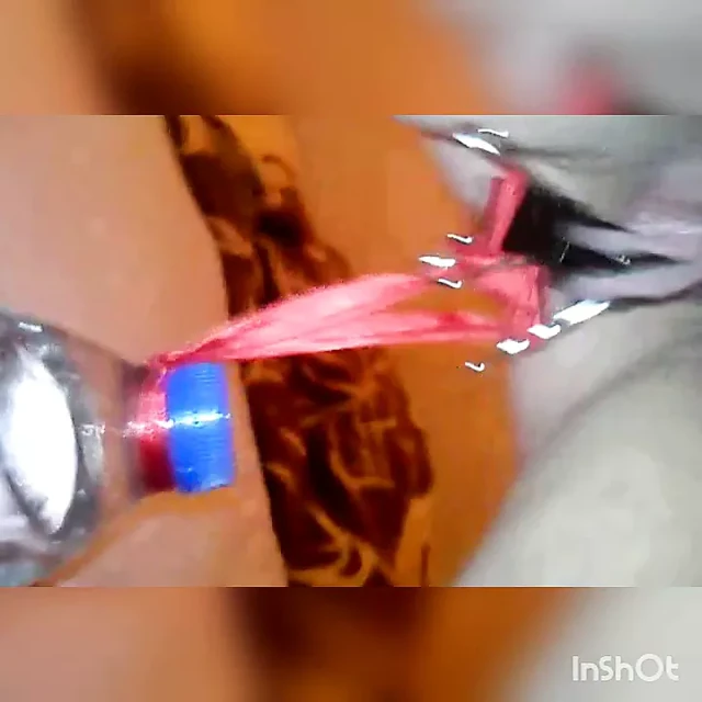 Slave lifts a water bottle with her pussy lips