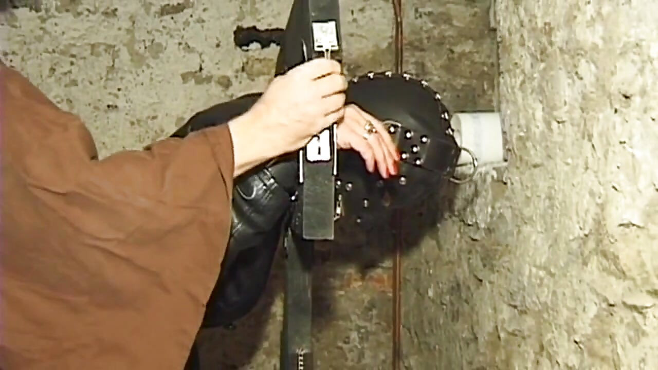 Bound Cougar Teased Relentlessly by Two Hooded Men