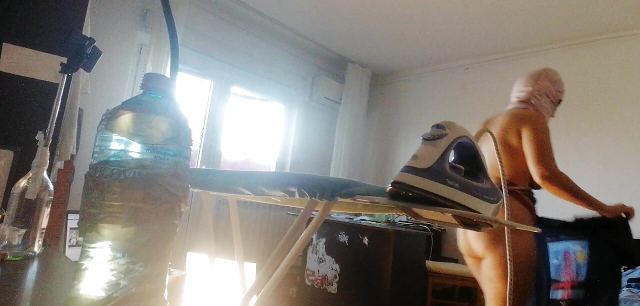 Amateur wife doing housework naked. Sexy and naughty wife trying on clothes that she cuts.