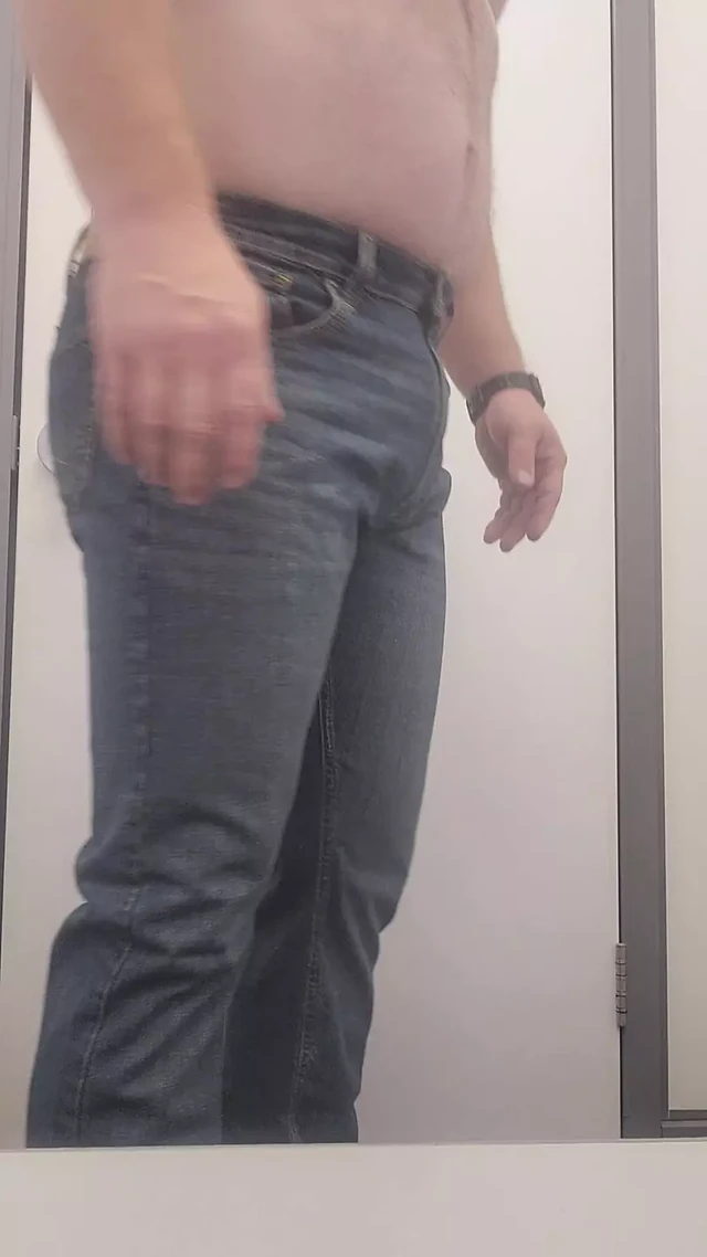 Trying on more clothes at the store.