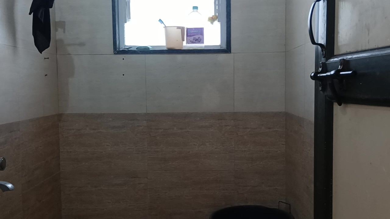 Indian boy wearing bra and panties in batharoom.