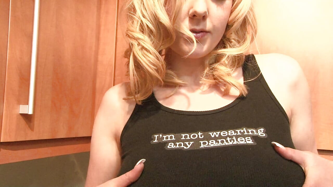 Blonde babe with big tits gets naked in the kitchen
