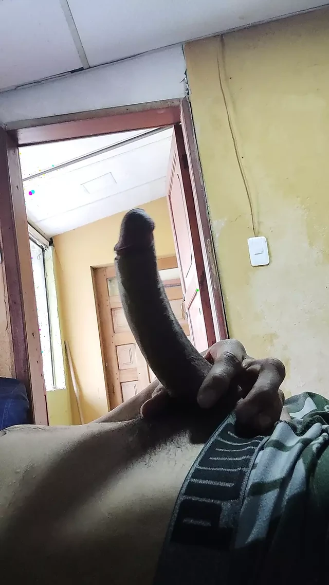 Masturbating my cock with the door open.