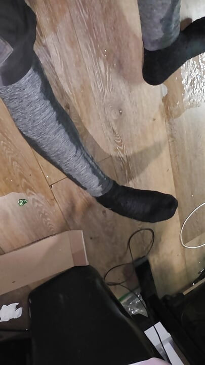 Massive flood in gray and shorts saturates wool socks