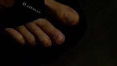 OUCHEE SHOWING OFF HIS TOES IN LOW LIT PUBLIC SIDEWALK