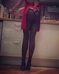 In the kitchen in pantyhose