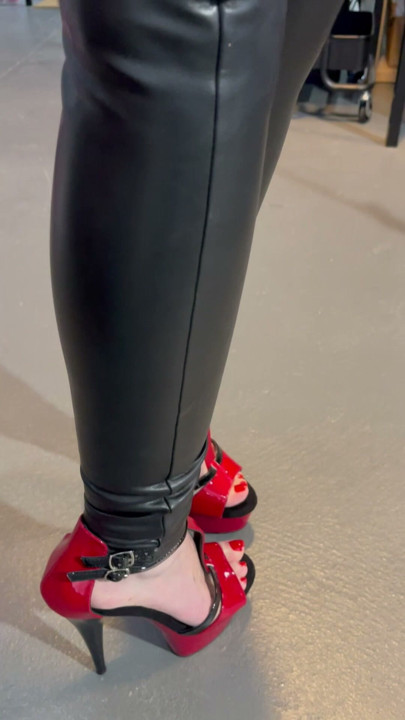 Black vinyl leggings in red stiletto heel.