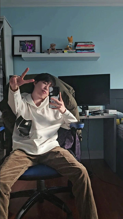 Asian boy taking selfie in front of mirror and secretly get hard