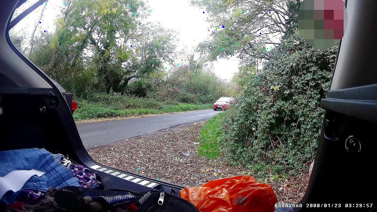 Just getting changed parked at side of road with cars driving past