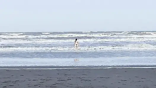 My neighbor loses her clothes at the beach.