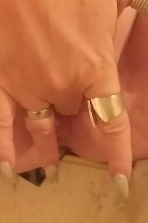 Horny Granny Masturbates on the Stairs