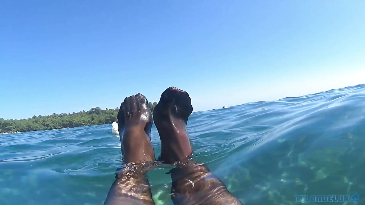 red toes and stocking in the sea