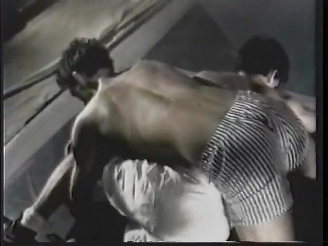 Guys with great bodies are having a wrestling game at the gym
