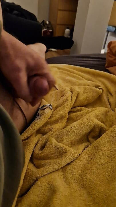 Jerking off alone.