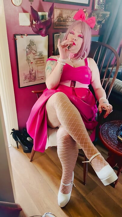 Pink To Make The Boys Wink! Tina Snua In A Leather Dress Smoking A Cigar