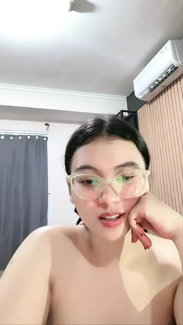 Sexy stylish glasses chick on camera