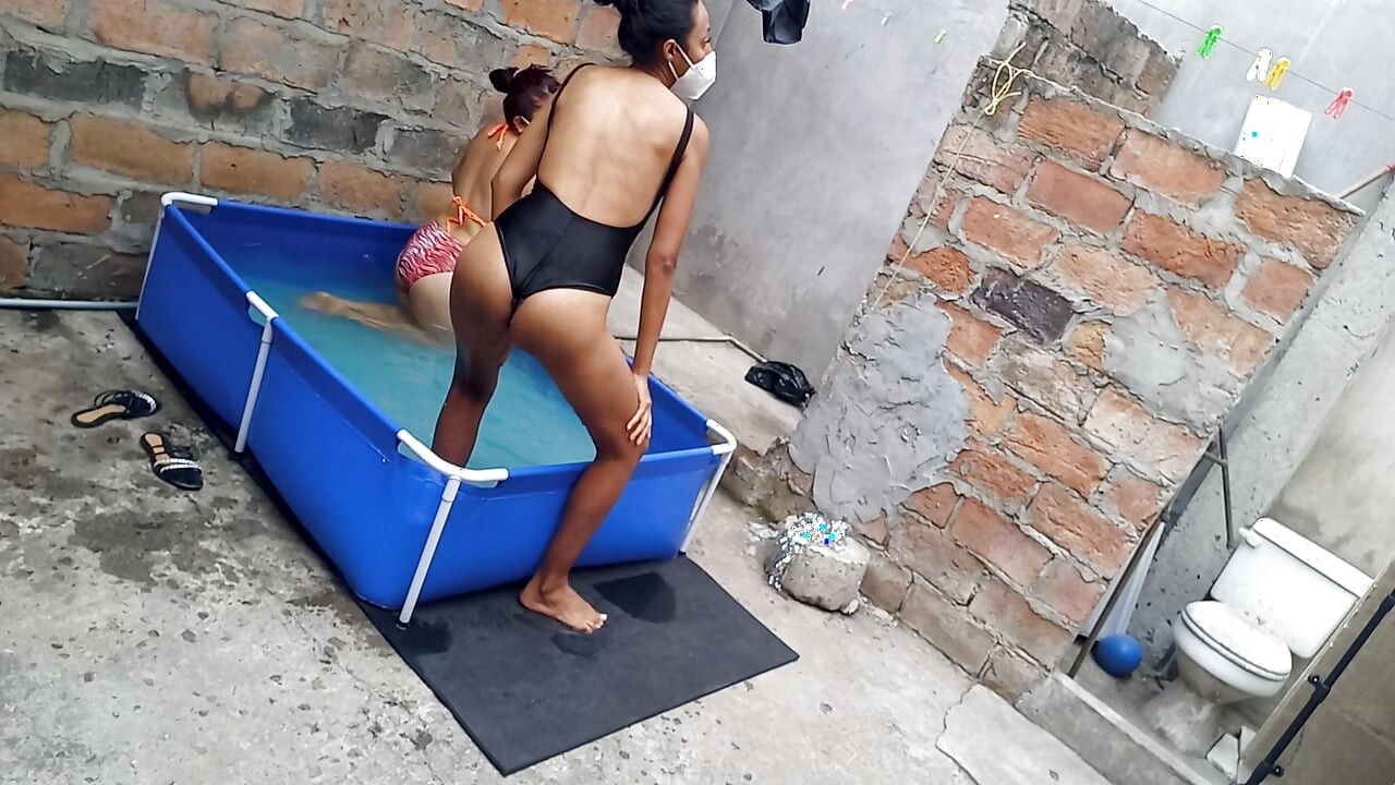 My neighbor is in the pool wearing a very tempting and sexy bikini. She's hot.