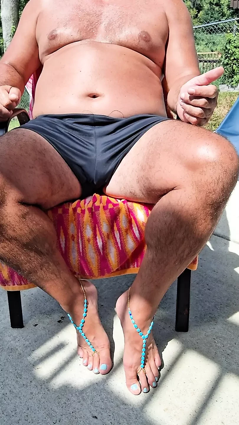 Sitting in my back yard getting a tan while showing off my cock and Gf's barefoot sandals
