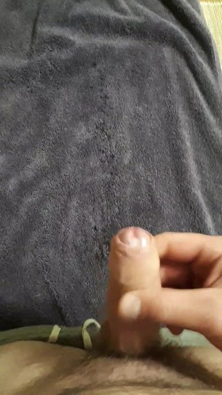 Spraying my cum over dark towel