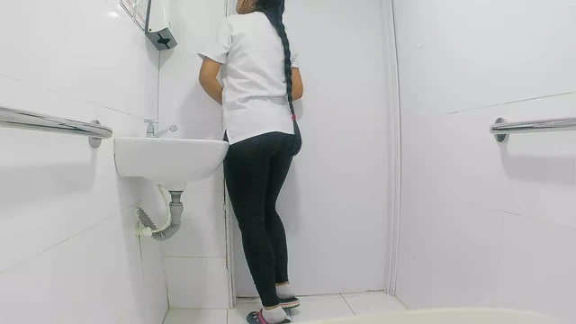 Amateur camera in public bathroom captures nurse pissing(public)