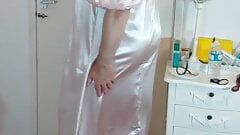 Crossdresser in shiny silky full length erotic satin gown.