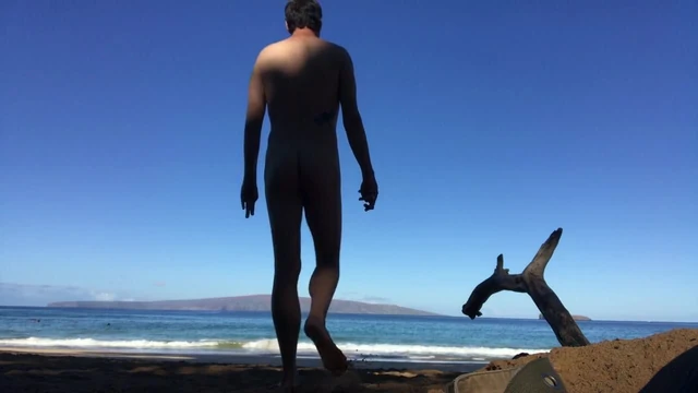 God walks into water at nude beach