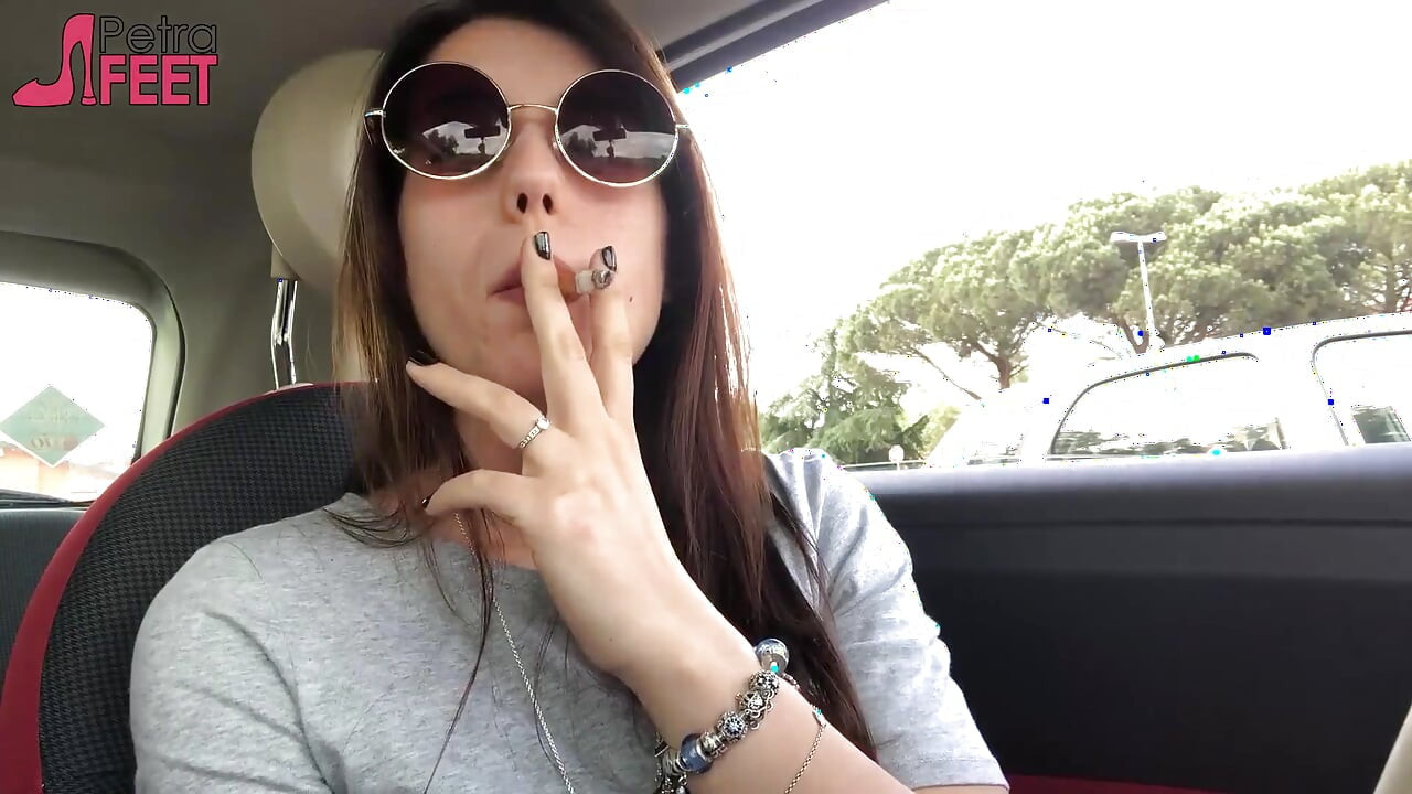 Petra smoking in car