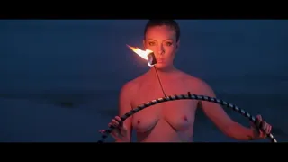 nude woman playing with fire