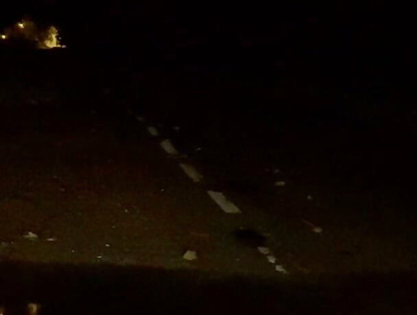 Naked in road and hiding the wrong side of road from safety when car passed