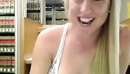 Cute blonde masturbates in library