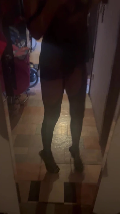 in black babydoll with suspenders for the club visit