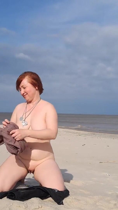 A biker girl strips naked and masturbates on a wild beach. | Clip 1