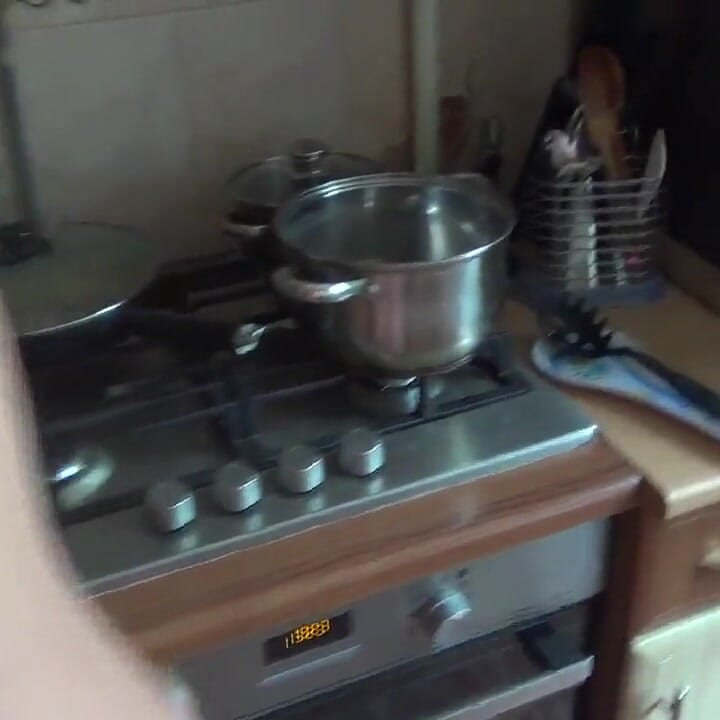 Kate washing in lingeria and high heels the dishes and  clears the sink
