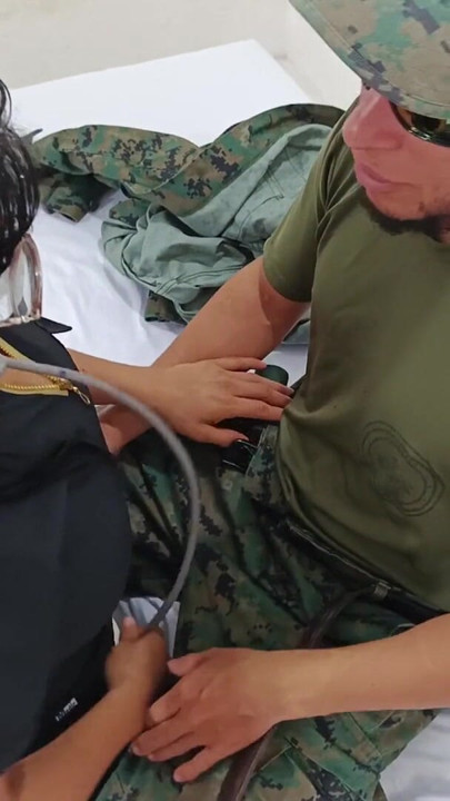 A doctor sensually gropes a soldier in the doctor's office during a consultation. | Clip 1