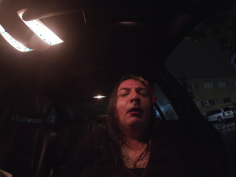 Mature sissy CD out in the rain in A parking lot in public masturbation.